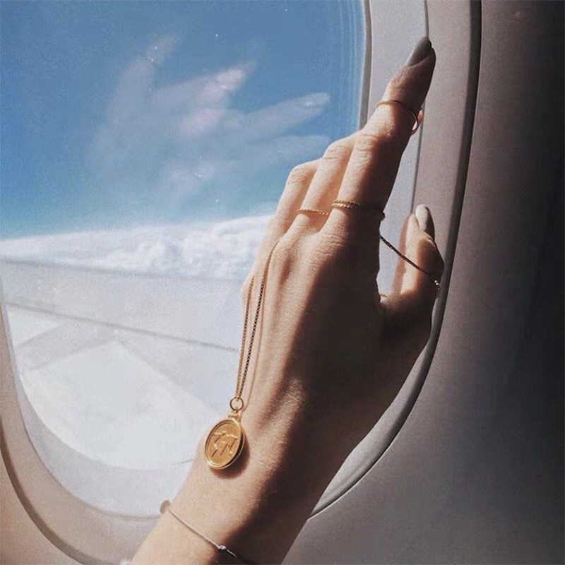 Collier carte du monde doré