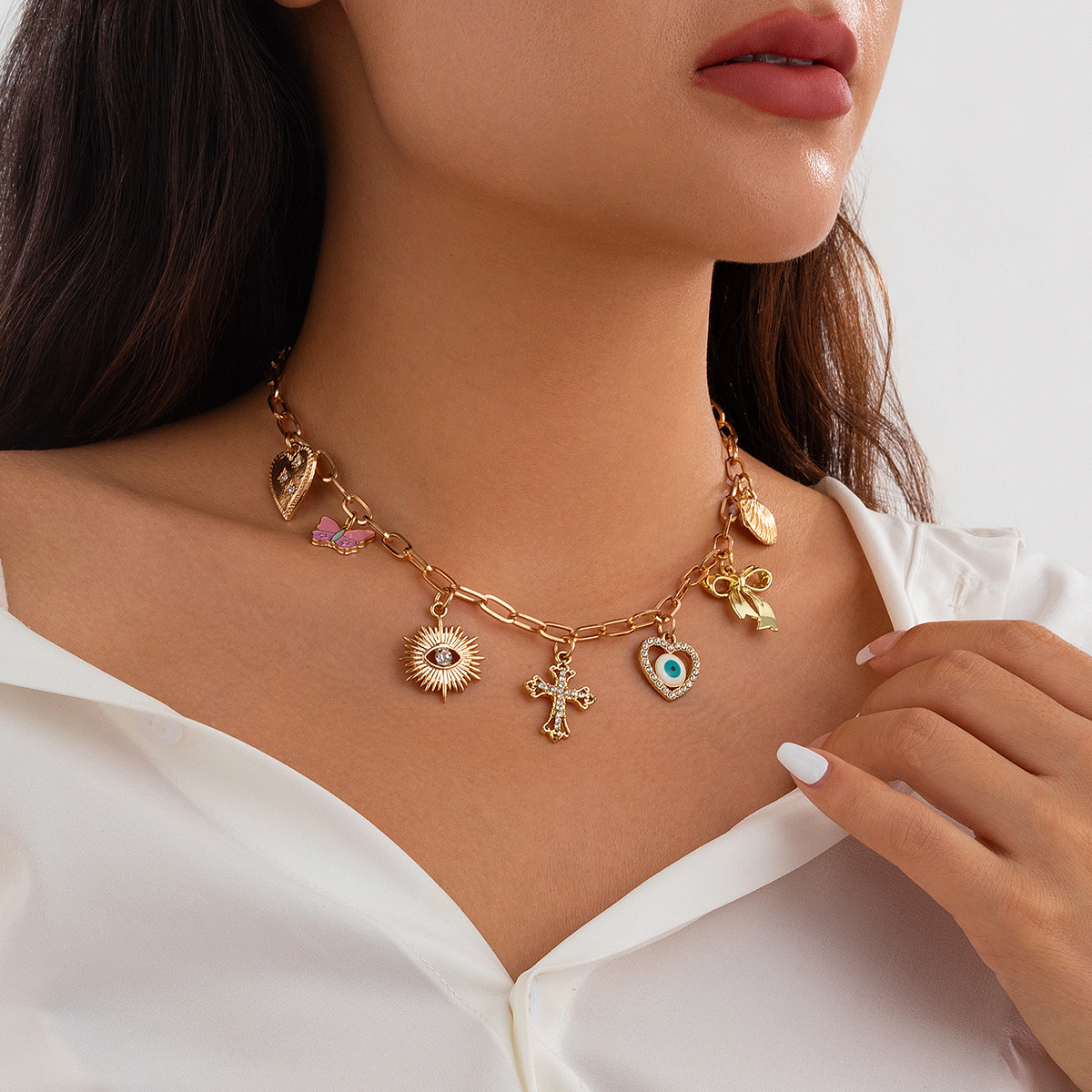 Collier pampilles multicharmes dorées