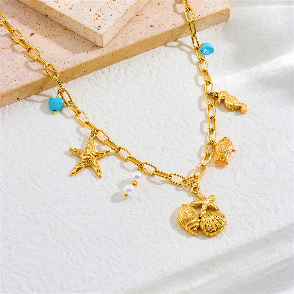 Collier pampilles doré coquillages et étoiles