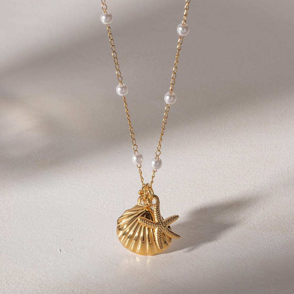 Collier coquillage doré et étoile de mer