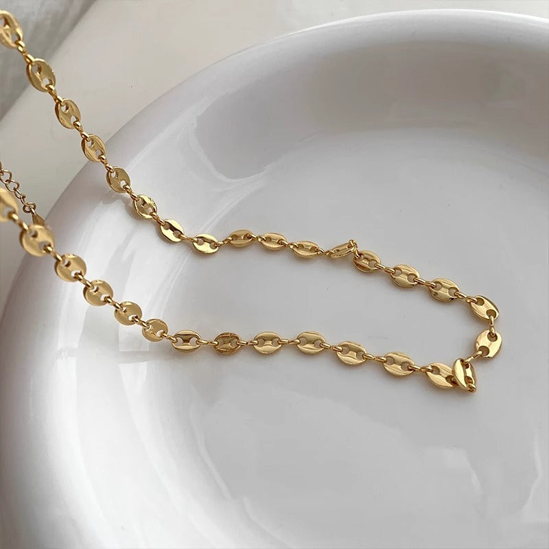 Collier grain de café doré