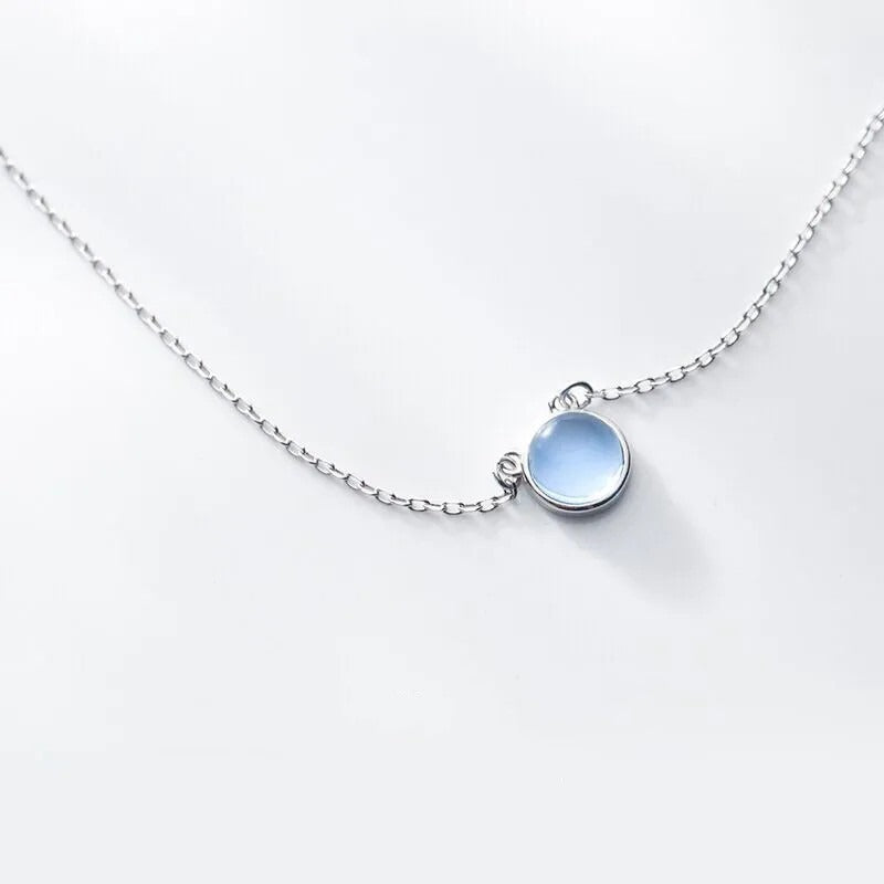 Pendentif rond avec pierre bleu