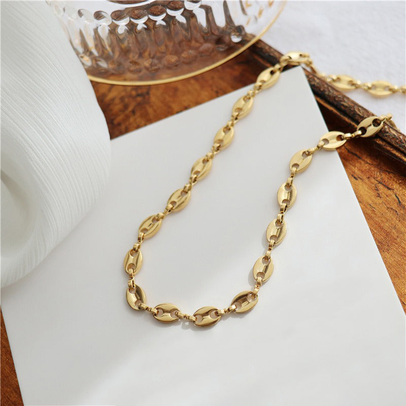 Collier grain de café doré