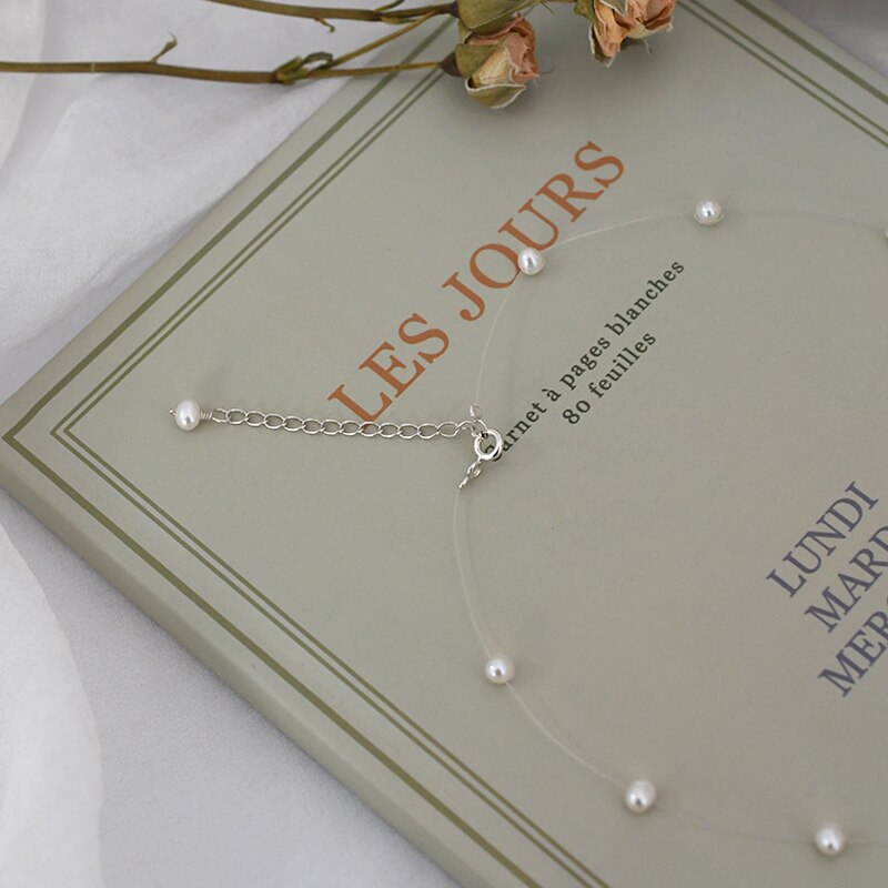 Collier perle fil transparent