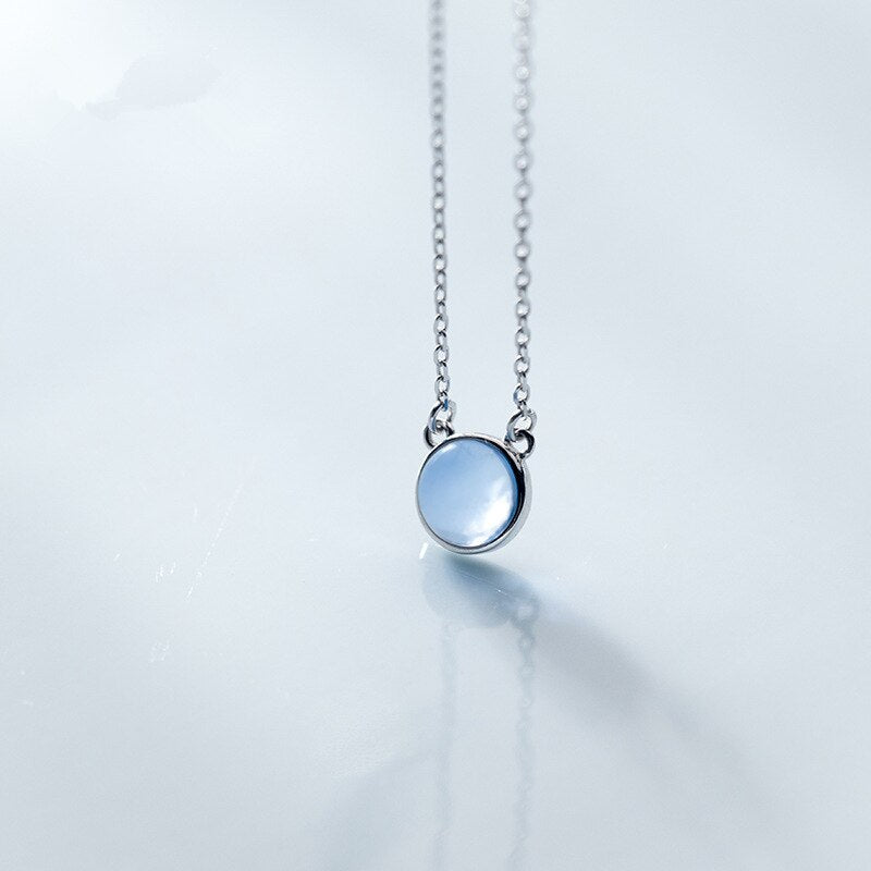 Pendentif rond avec pierre bleu