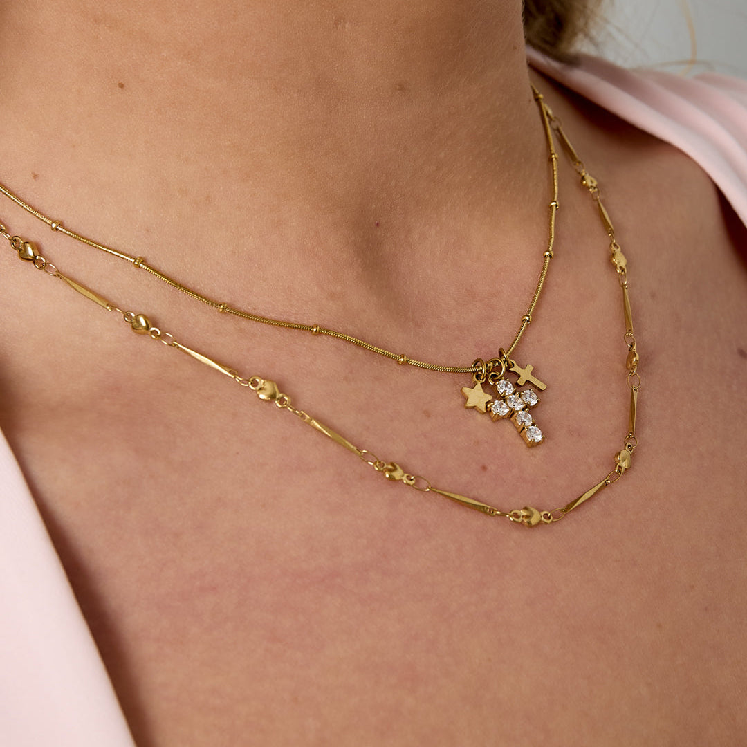 Collier avec breloques en forme de croix et d'étoile Image