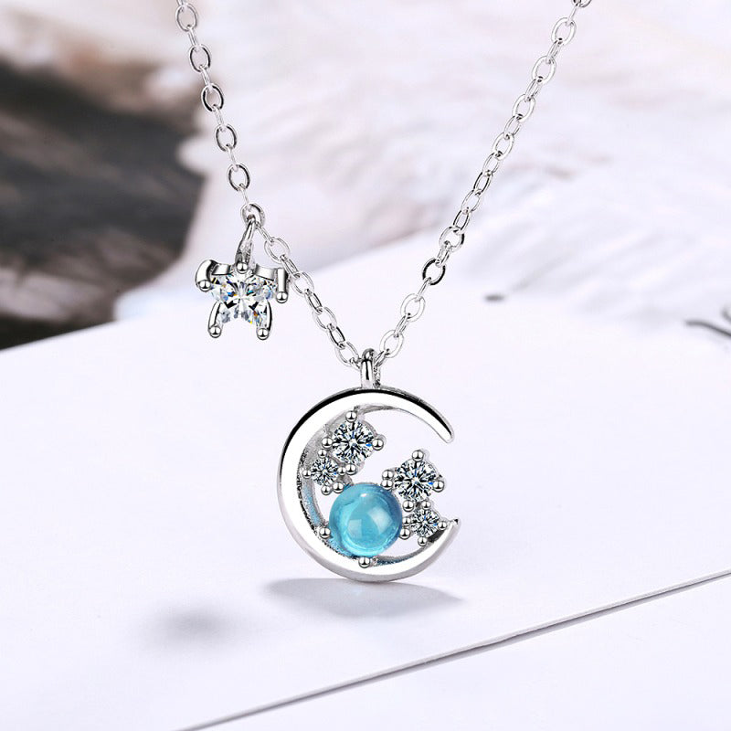 Pendentif lune et étoile bleu argenté