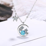 Pendentif lune et étoile bleu argenté