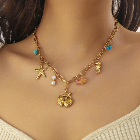 Collier pampilles doré coquillages et étoiles