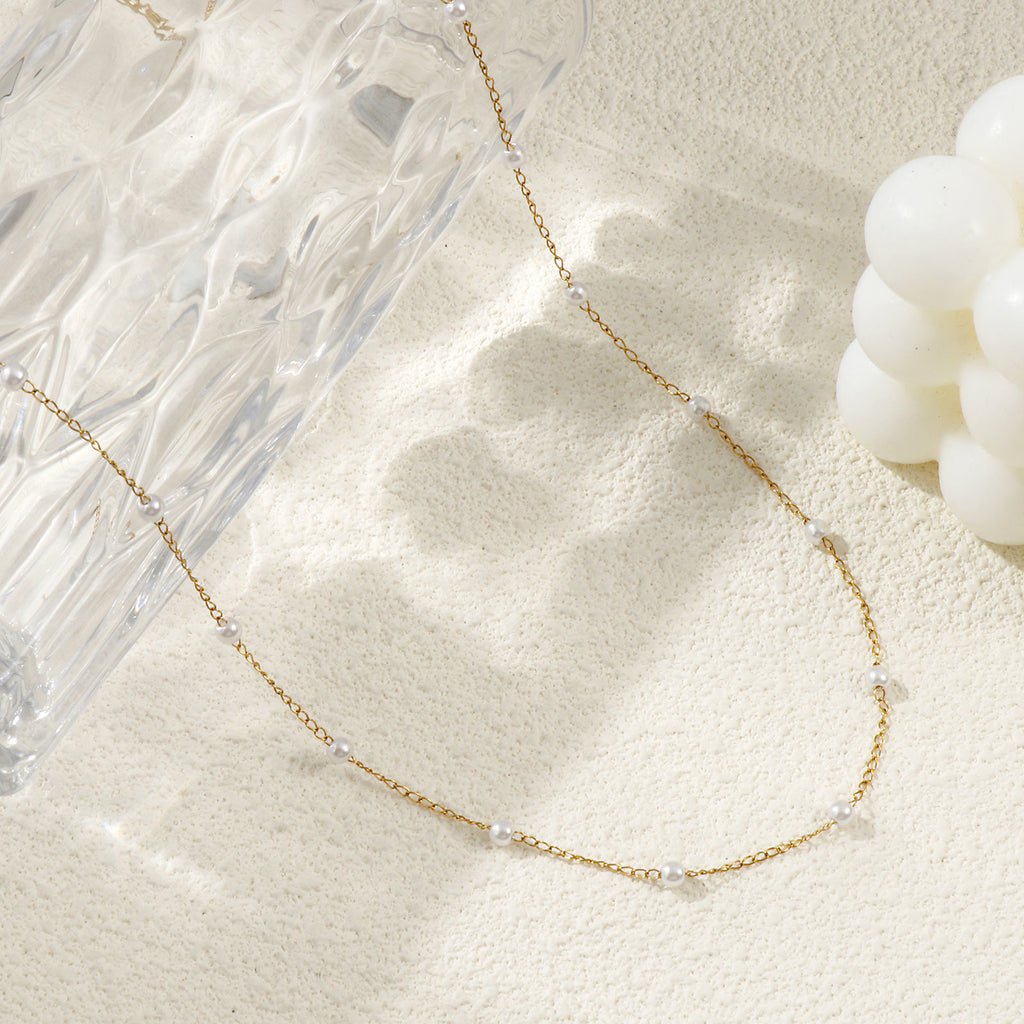 Collier perles d'imitation espacées doré