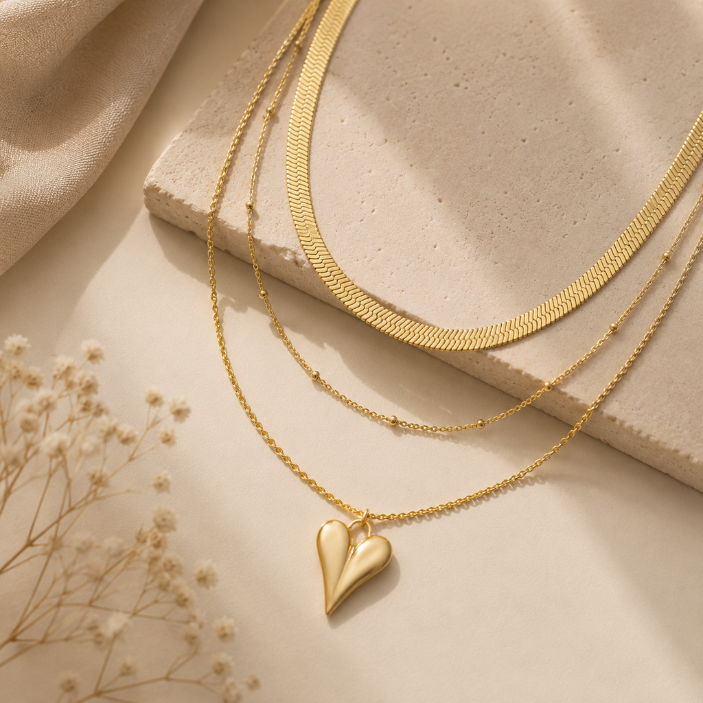 Collier triple chaîne grand cœur doré