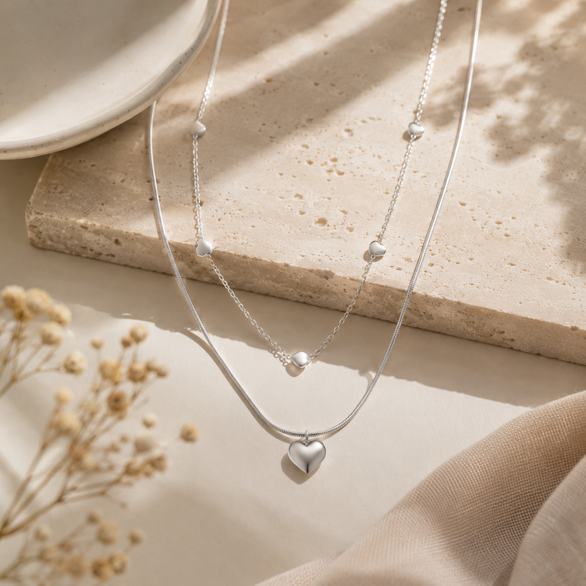 Collier double chaîne cœurs multiples argenté