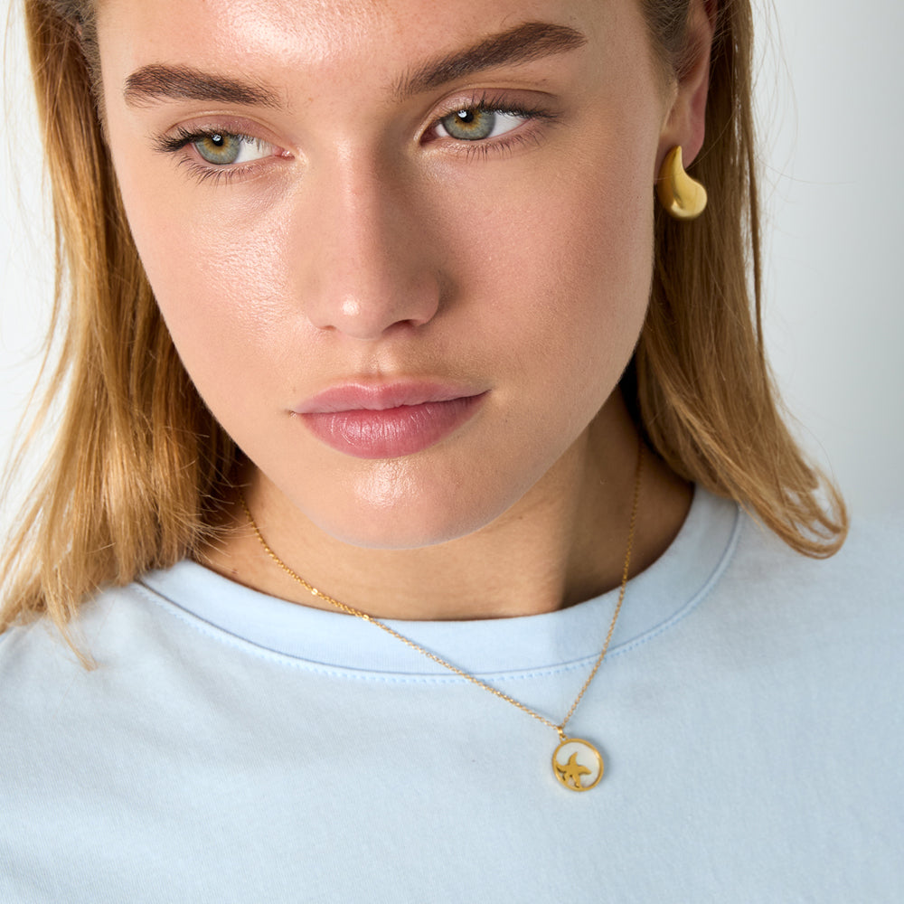 Collier étoile de mer sur médaillon coquillage