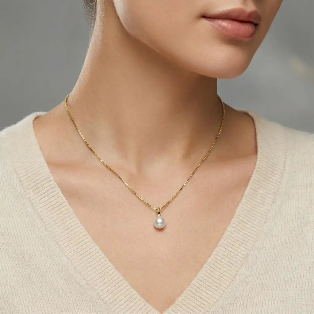 Collier pendentif perle doré