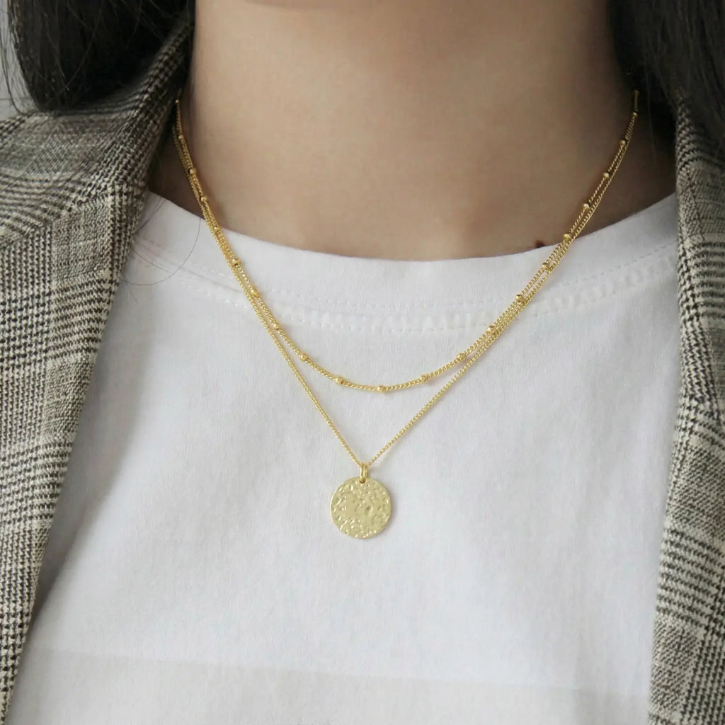 Collier pendentif rond texturé