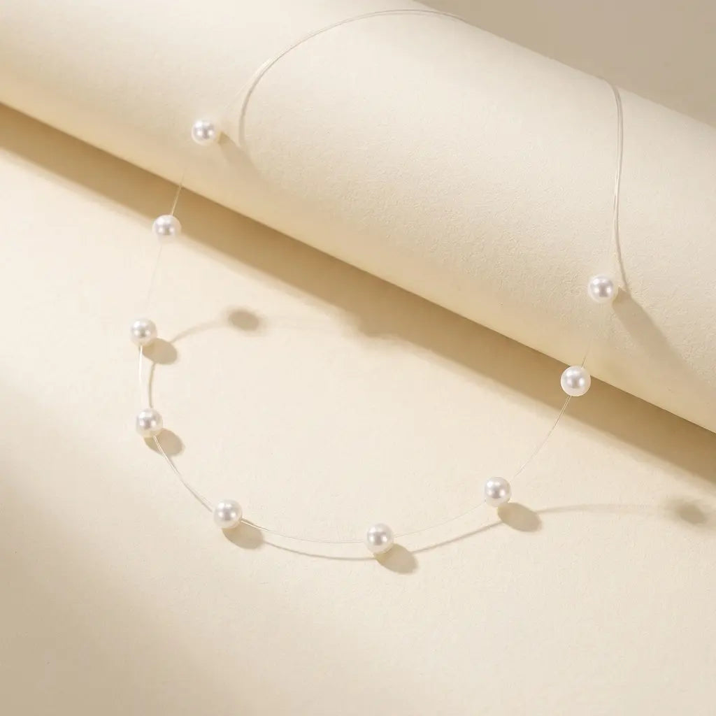 Collier perle fil transparent