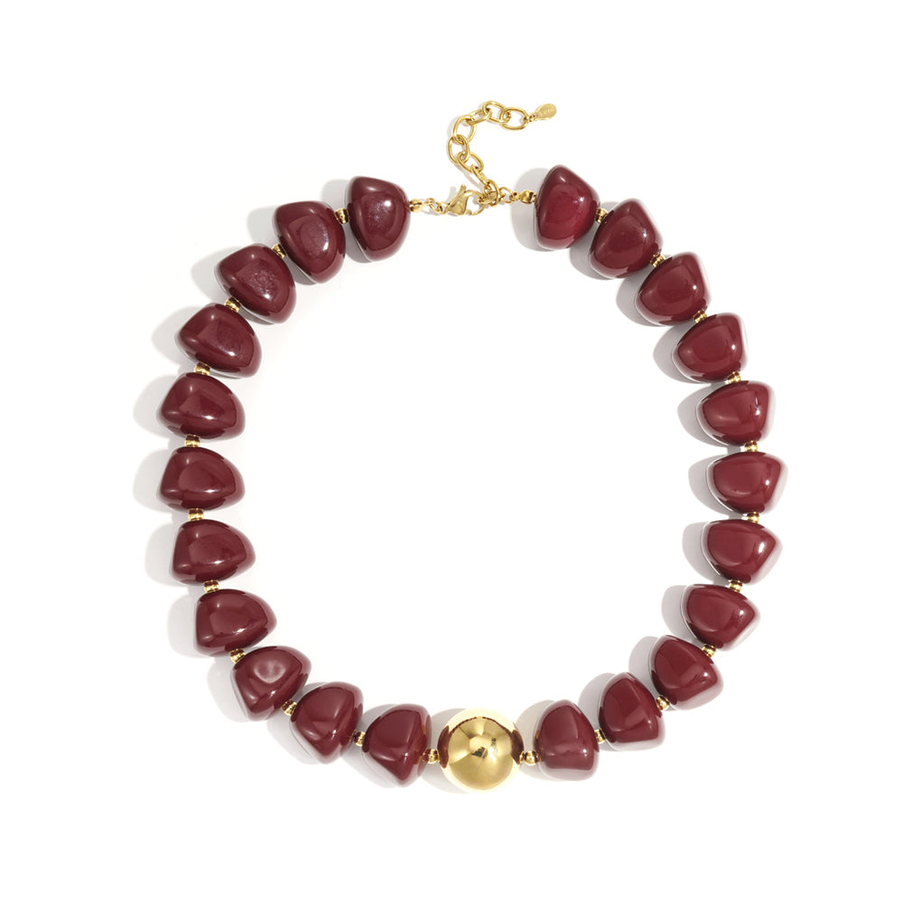 Collier perles d'imitation acrylique et sphère dorée