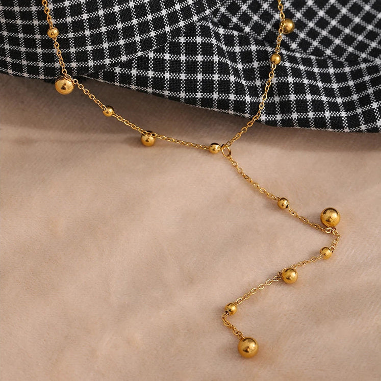 Collier en Y à pampilles doré