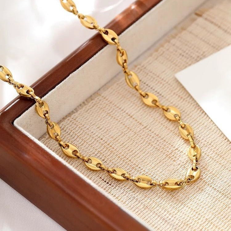 Collier grain de café doré