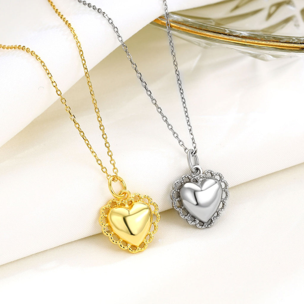 Pendentif cœur sacré argent et doré