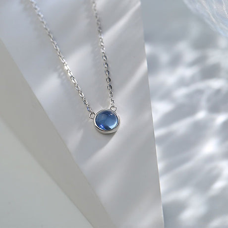 Pendentif rond avec pierre bleu