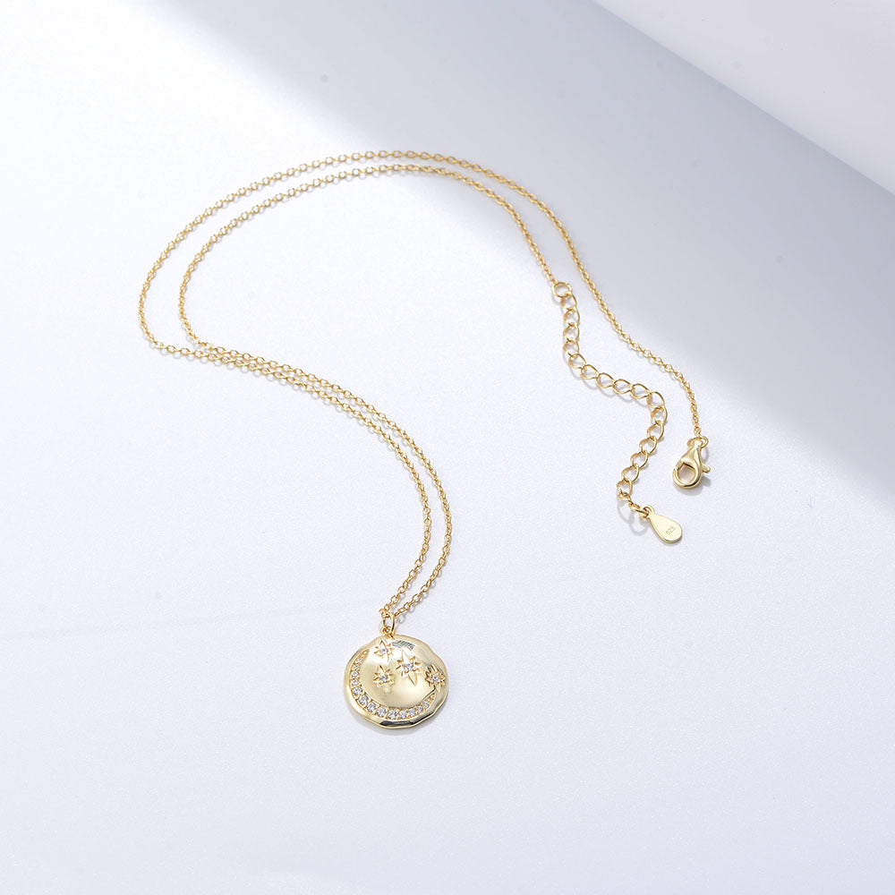 Collier pendentif lune et étoiles doré