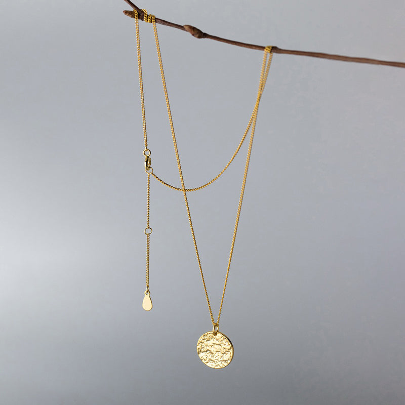 Collier pendentif rond texturé