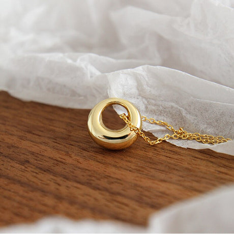 Collier or avec pendentif rond