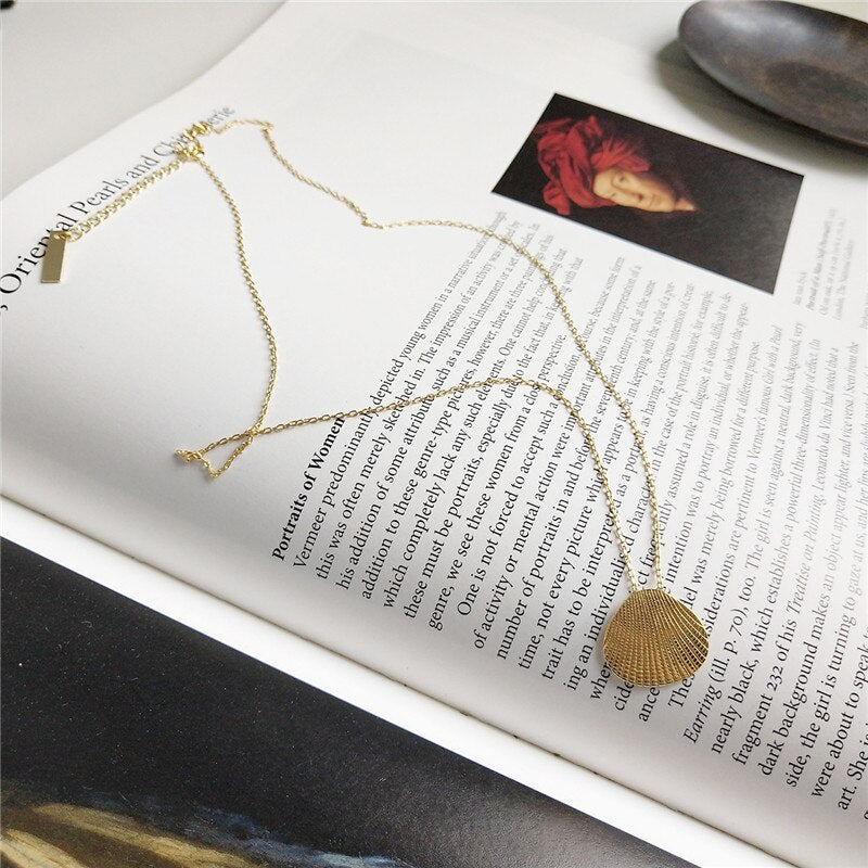 Collier coquillage doré