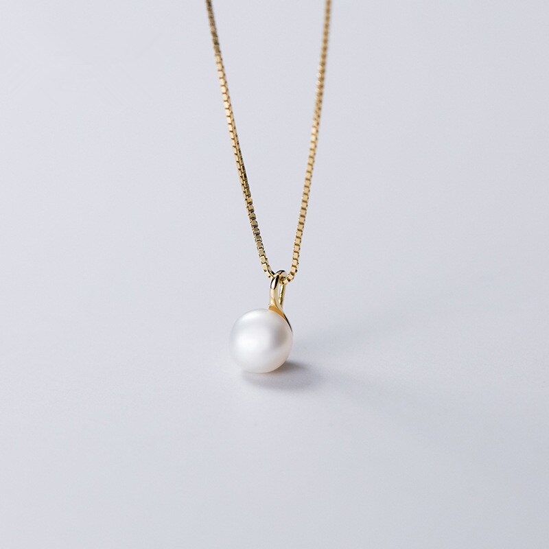 Collier pendentif perle