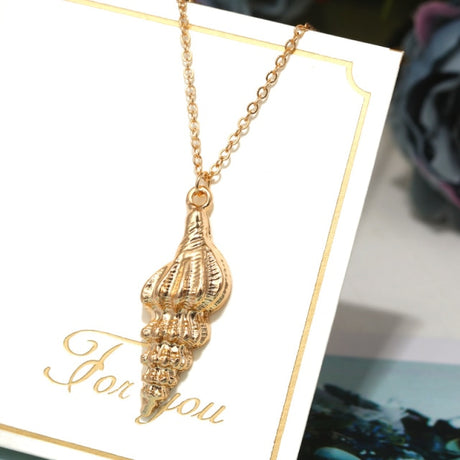 Collier coquillage en or